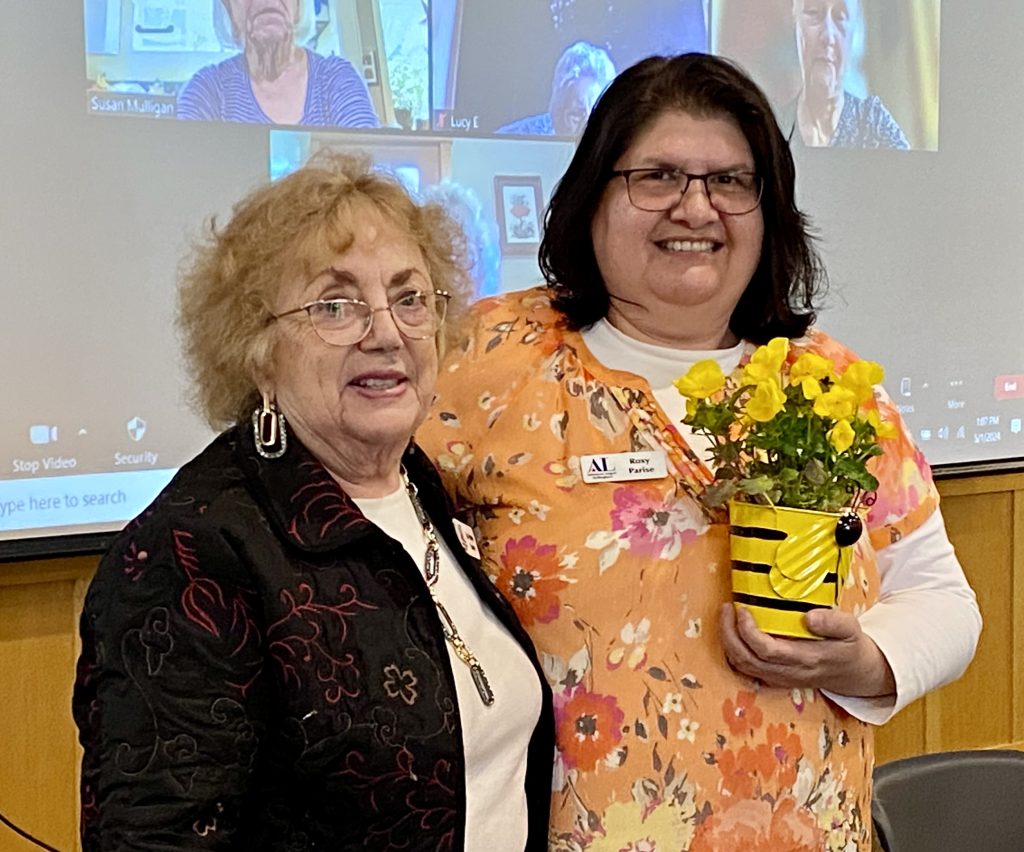 Jo Anne Lowe presents Busy Bee Award to Roxy Parise