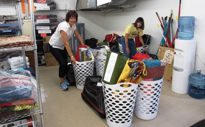 Members assembling Empowering Youth kits