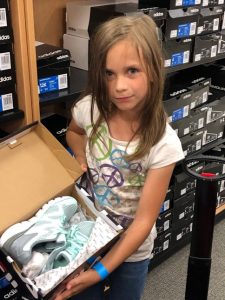 OSB CC 484x645 Girl shoe shopping at Canyon County Branch's first Operation School Bell event.