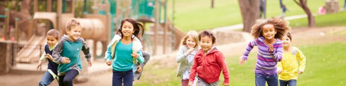 iStock-494239087-children-playing-OSB 2121x550 Group Of Young Children Running In Park