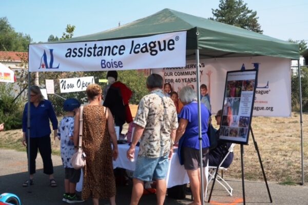Visitors gathering around our booth at Experience Garden City