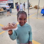 Girl holding glittery sneaker