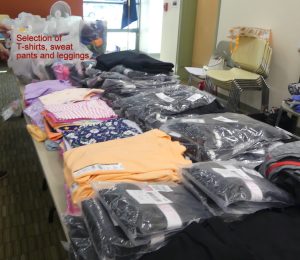 Selection of T-shirts, sweat pants, and leggings