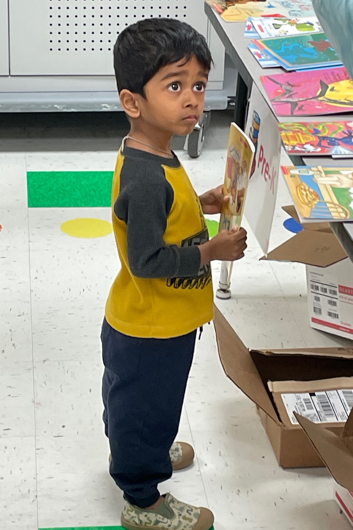 A child holds his new book