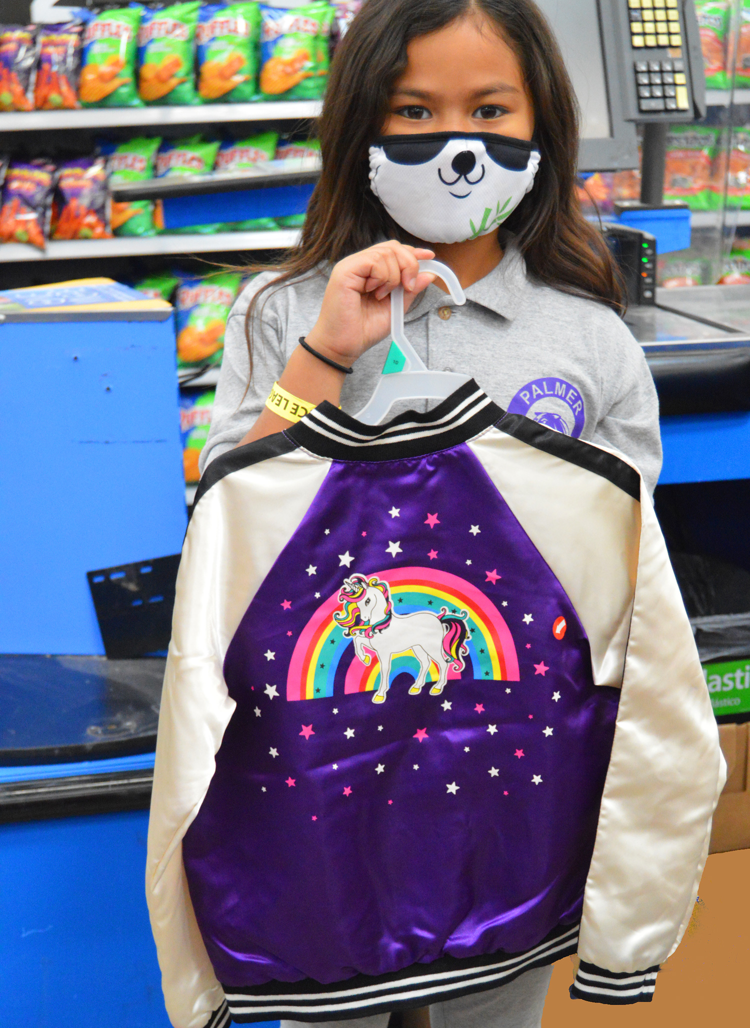 girl holding sweatshirt
