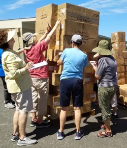 Unloading pallets of uniforms from the truck
