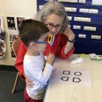 Volunteer working with preschooler