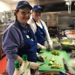 Serving dinner at Family Supportive Housing