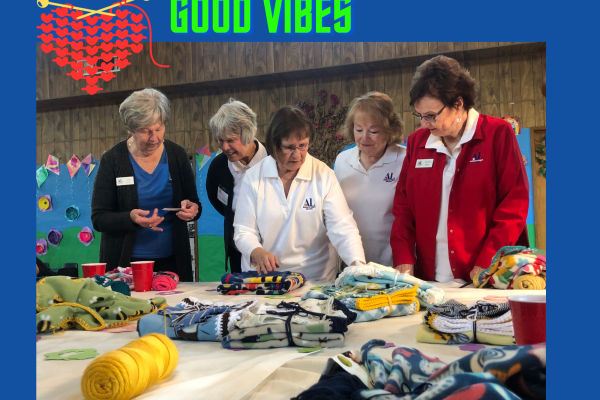 Caring Hands Volunteers Folding Blankets