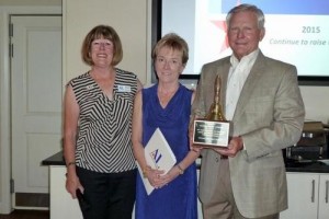 Assistance League of Southern Utah President Martha Heuer and Debbie and Don Stricklin, residents of SunRiver, Utah.