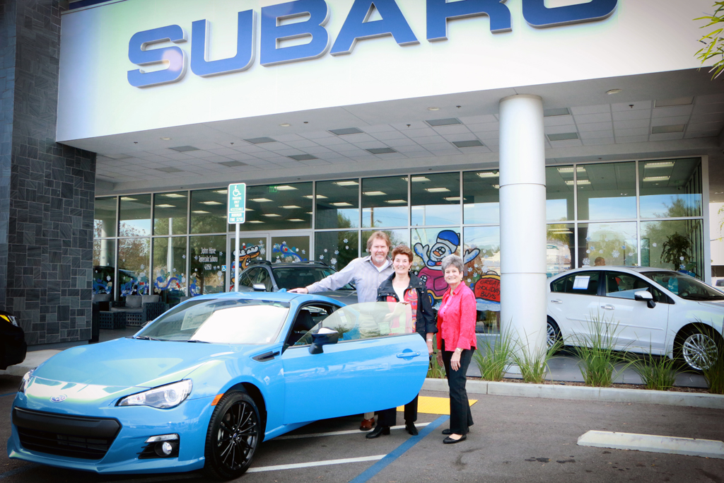 : Pictured from left are Bill Brumbaugh, VP/General Manager of John Hine Temecula Subaru; Assistance League Past Presidents/Community Ambassadors Dorcas Shaktman and Electra Demos admiring one of the Subarus available for purchase at the dealership at 42050-A Dealers Drive, Temecula. Courtesy photo