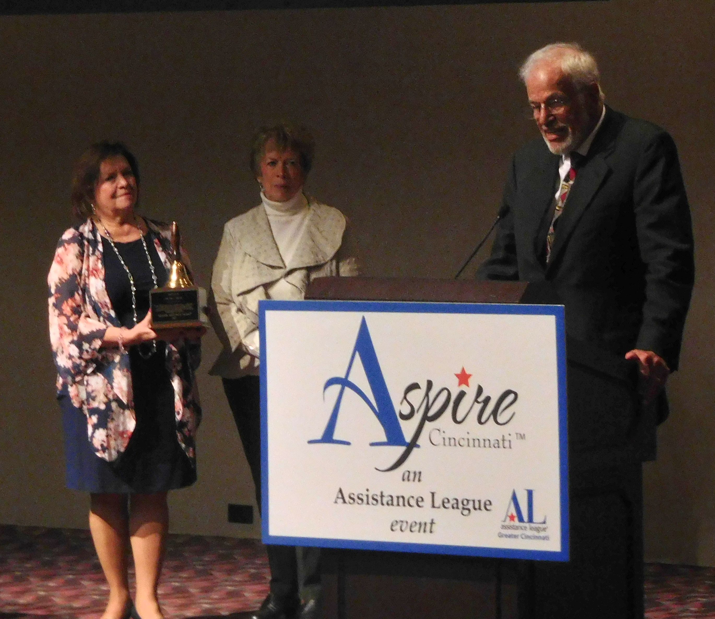 L-r: Betty Rothgeb, holding the school bell, and Mary King, Operation School Bell co-chairs, and Walter C. Frank