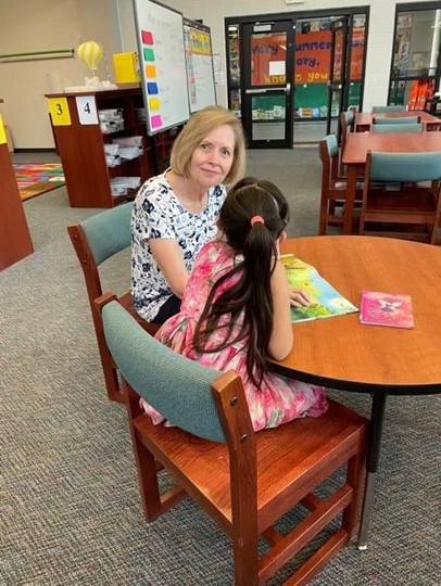 Montgomery County - Assistance League continues serving throughout the summer (001) Molly Parkhill with her Reading Buddy