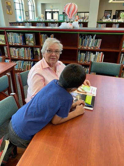 Montgomery County - Assistance League continues serving throughout the summer (002).jpg Colleen Cremer with her Reading Buddy