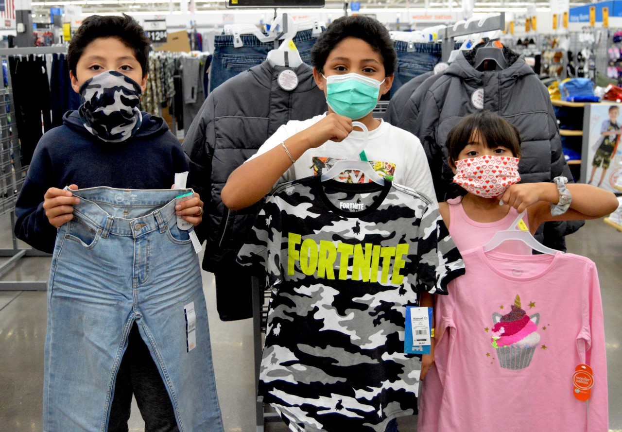 Reno-Sparks - Assistance League Clothes Almost 2,000 Deserving School Children children holding new clothes